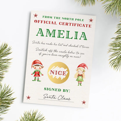 The image is a Christmas-themed certificate or card with illustrations of Santa Claus and two children, likely named Amelia. The text on the card reads "From the North Pole Official Certificate AMELIA" and "Santa has made his list and checked it twice. Scratch off the circle below to see if you've been naughty or nice!" The card is signed by "Santa Claus".
