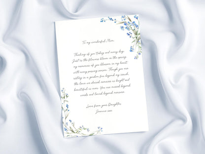 a handwritten letter with a floral border, placed on a white background.