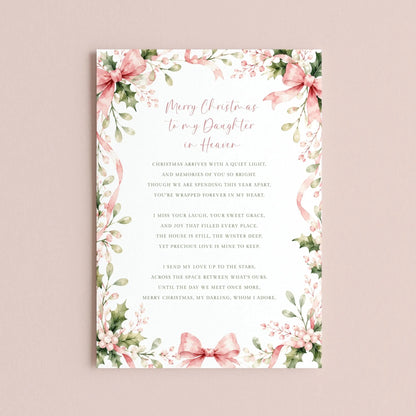 The image is a Christmas card with a floral border and a message about the daughter in heaven.