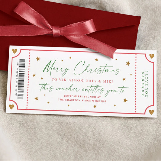 a Christmas gift card with a red envelope and a red ribbon, placed on a white surface.