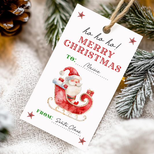 A white Christmas gift tag with a Santa Claus illustration and text that reads "ho ho ho! Merry Christmas To: Maisie" and "FROM: Santa Claus".