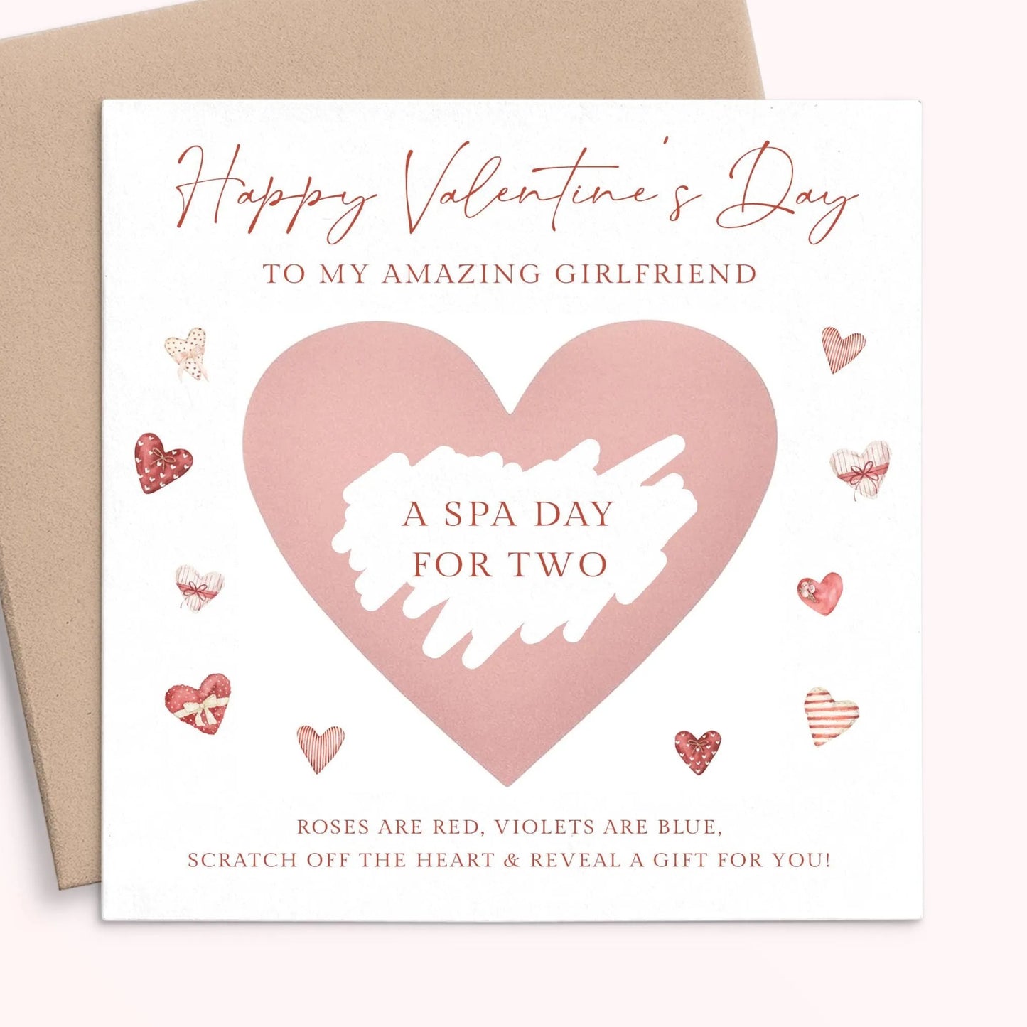 The image is a Valentine's Day card with a pink heart-shaped design and various heart-shaped and heart-themed illustrations surrounding it. The card has a message that reads "Happy Valentine's Day to my amazing girlfriend" and "A spa day for two" along with a list of items such as "Roses are red, violets are blue, scratch off the heart & reveal a gift for you!"