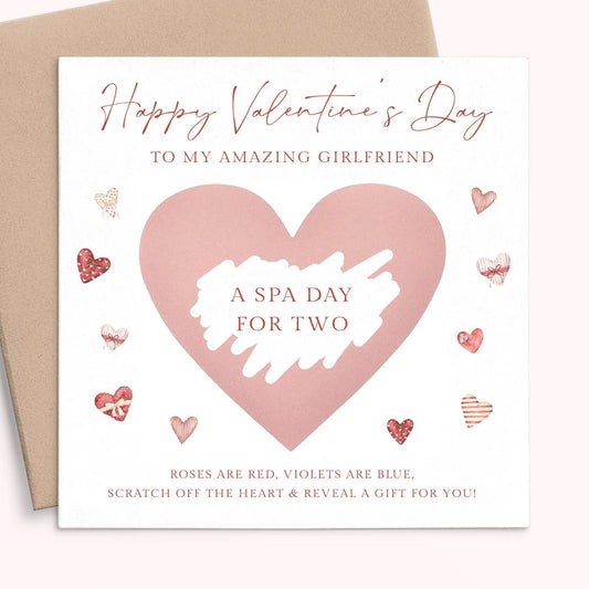 The image is a Valentine's Day card with a pink heart-shaped design and various heart-shaped and heart-themed illustrations surrounding it. The card has a message that reads "Happy Valentine's Day to my amazing girlfriend" and "A spa day for two" along with a list of items such as "Roses are red, violets are blue, scratch off the heart & reveal a gift for you!"