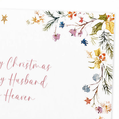 The image is a Christmas card with a floral border and a message that reads "Merry Christmas by Husband to Heaven".