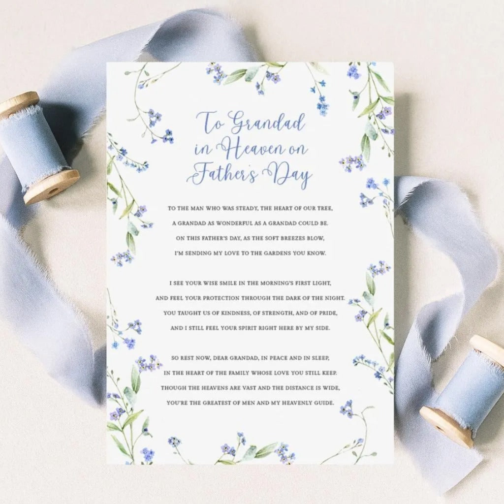 a floral-designed card with a heartfelt message for a father's day, accompanied by a ribbon and spool of thread.
