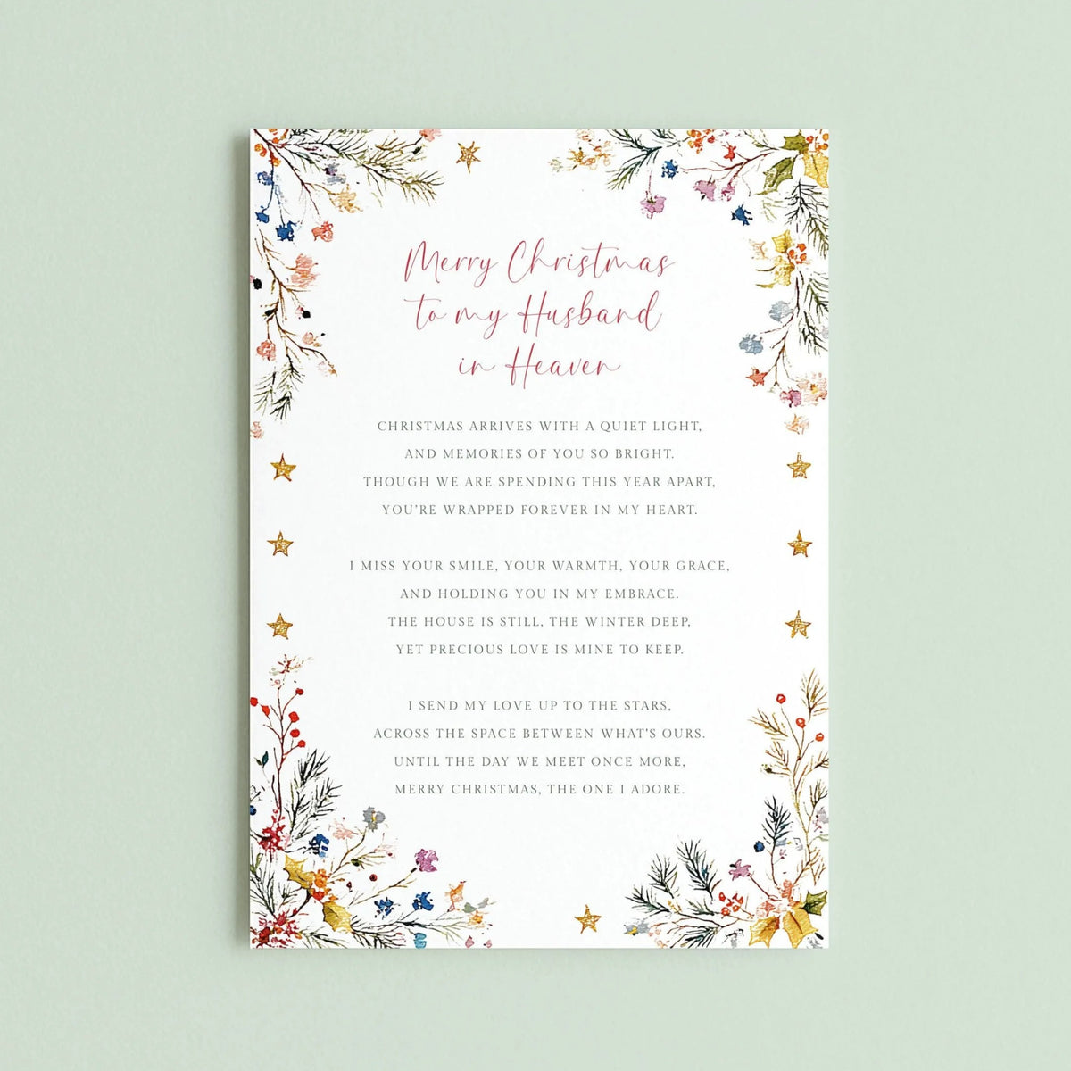 May include: A rectangular white greeting card featuring a floral border with pine needles, berries, and gold stars. The text reads: Merry Christmas to my Husband in Heaven, followed by a poem about missing a loved one during the holiday season.