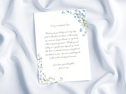 a handwritten letter with a floral border, placed on a white background.