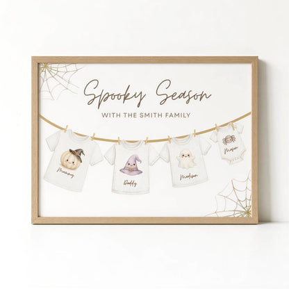 The image is a framed print featuring a spooky season theme with illustrations of Halloween-themed t-shirts hanging on a clothesline.