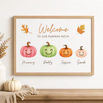 a framed sign with a welcoming message for a pumpkin patch, accompanied by four smiling pumpkins representing different family members.