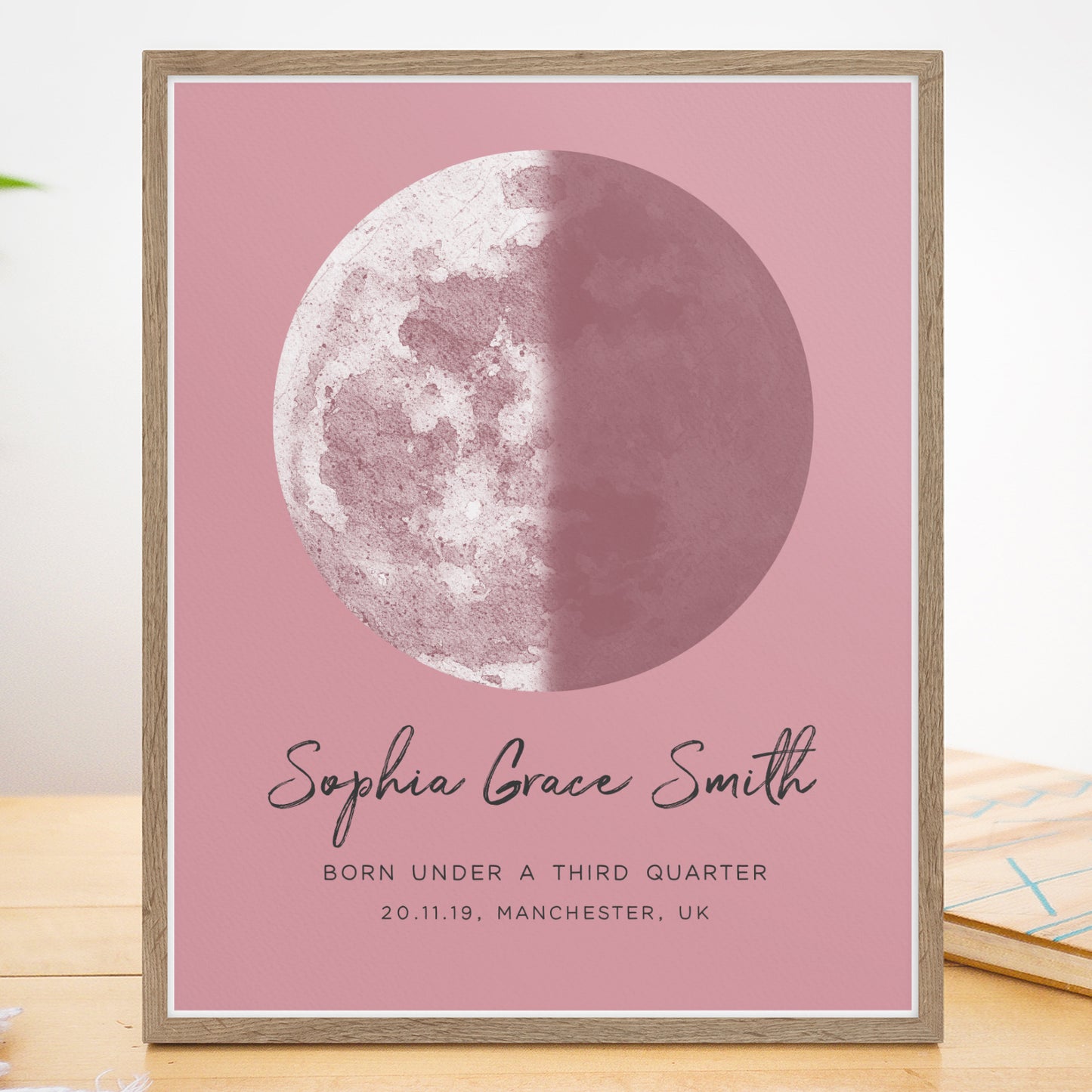 a pink card with a picture of the moon on it