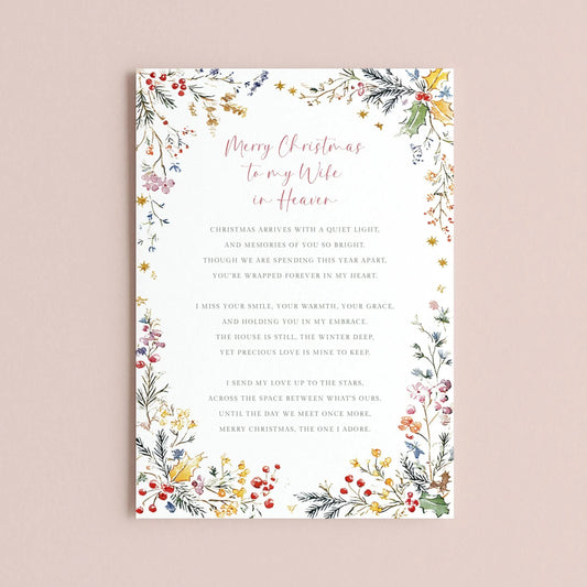 The image is a Christmas card with a floral border and a heartfelt message for a wife in heaven.