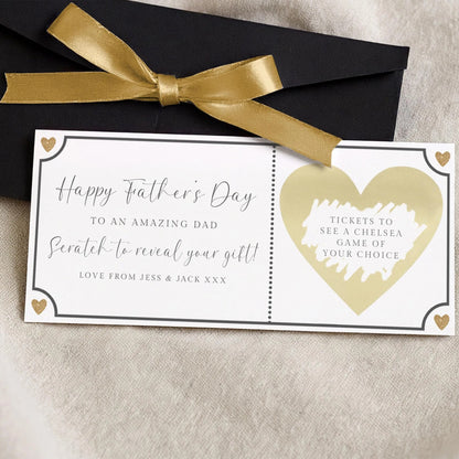 a card with a gold ribbon and a heart-shaped ticket design, along with a message for Father's Day.