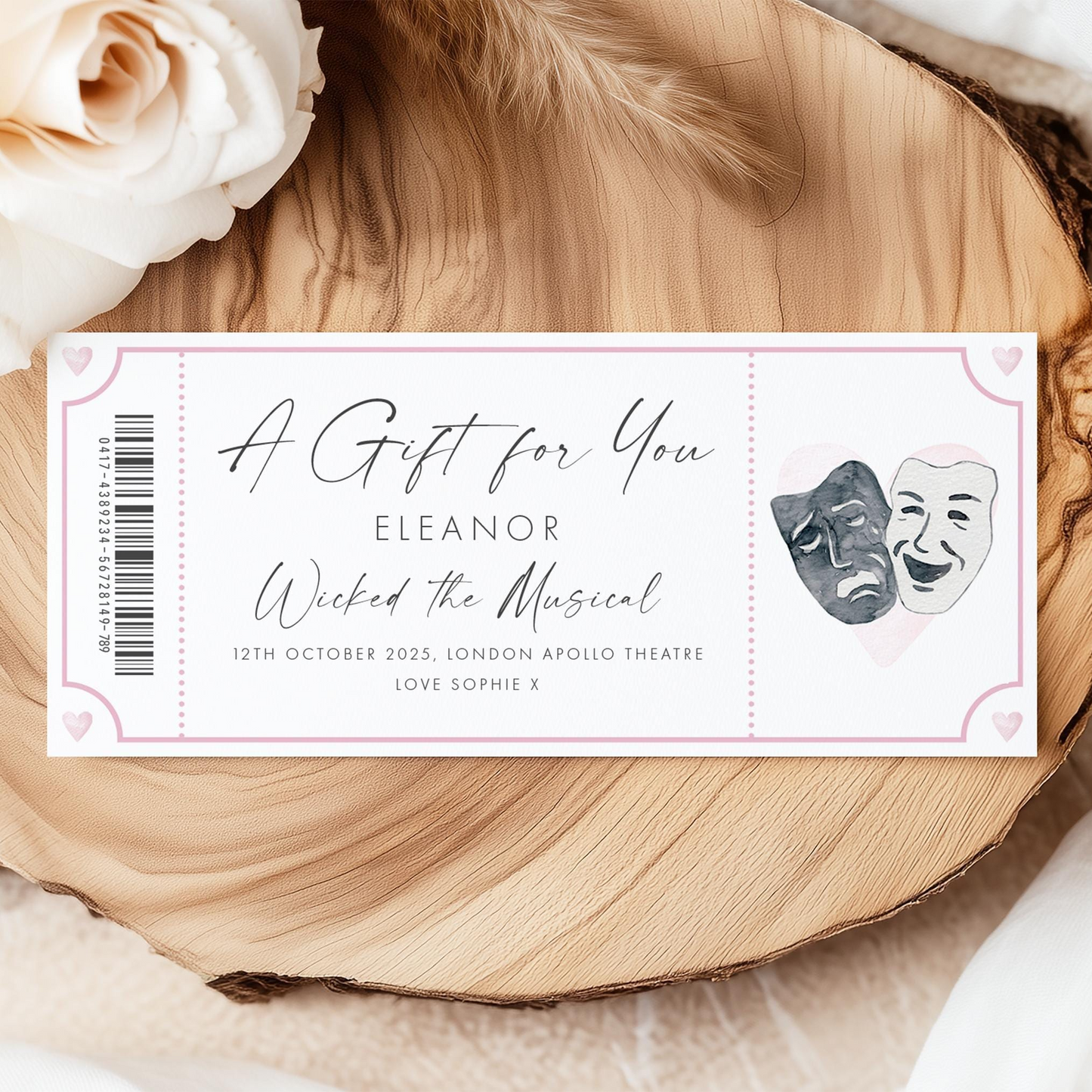 A ticket for a musical performance titled "Wicked the Musical" by Eleanor, featuring two theatrical masks and a rose.