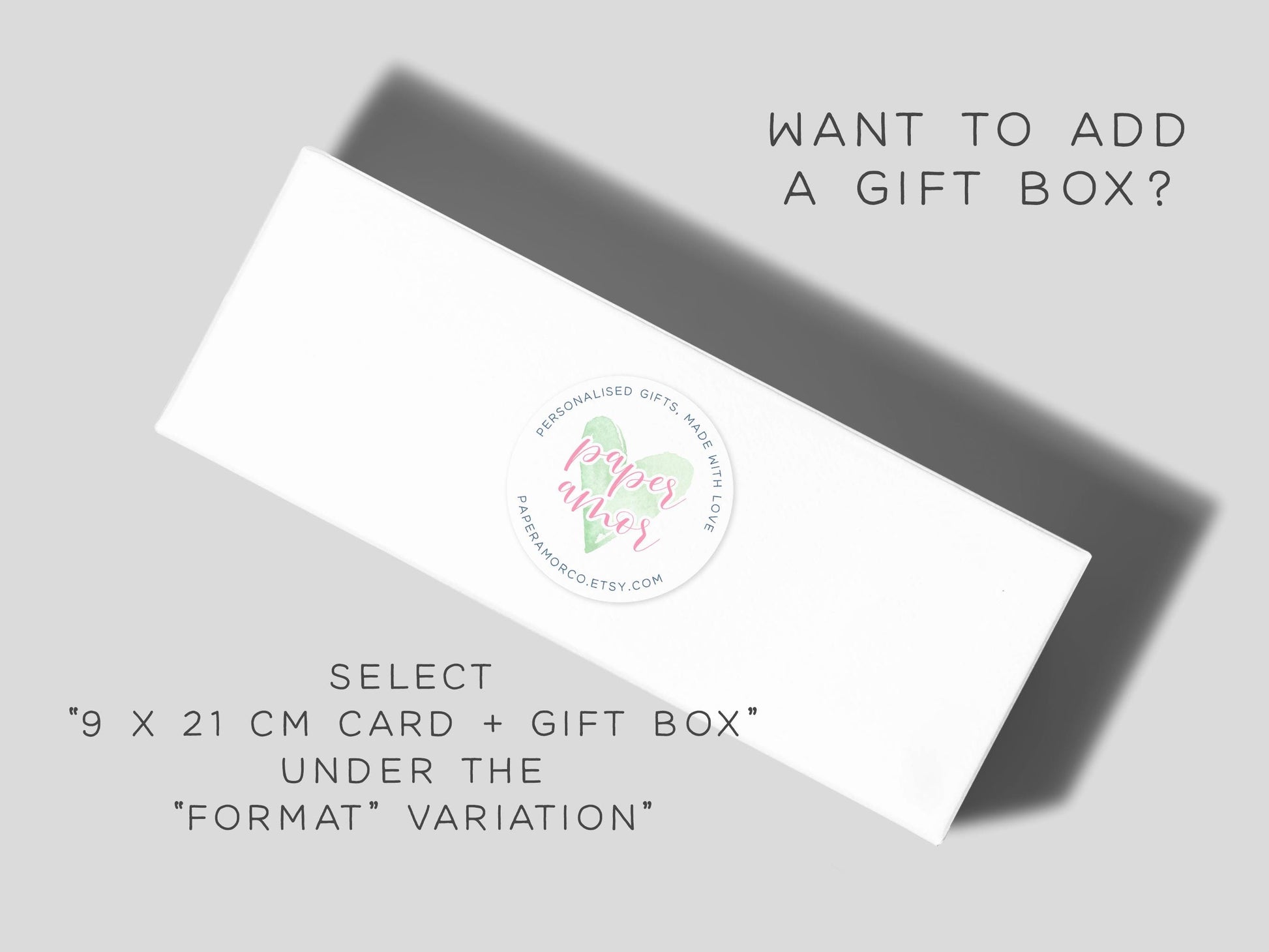 The image is an advertisement for a gift box service, featuring a white rectangular box with a label that reads "Paper Love" and "Select 9 x 21 cm Card + Gift Box Under The 'Format' Variation".