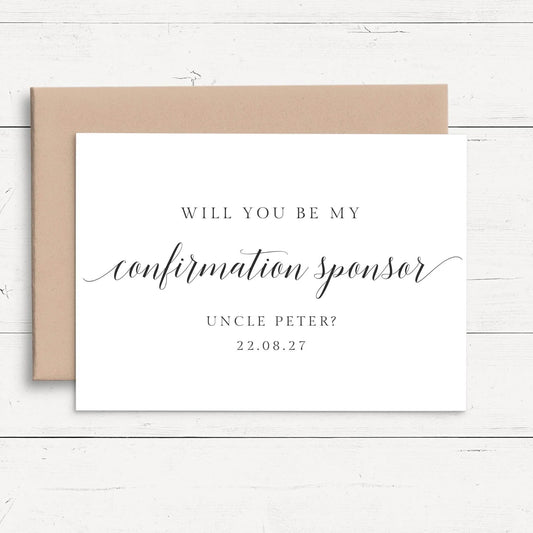 a white card with black text and a brown envelope, placed on a white wooden surface.