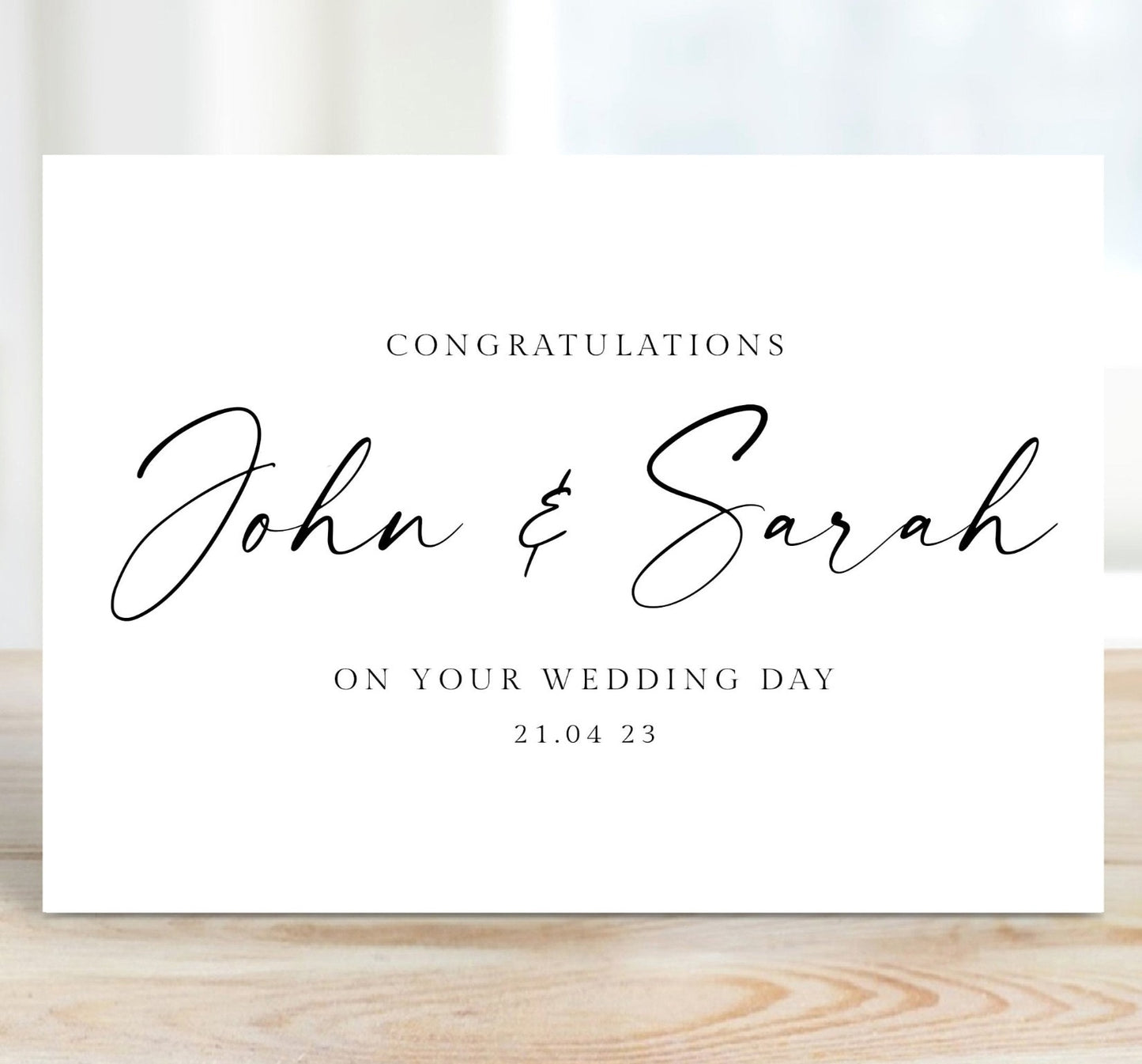 black and white minimalist script wedding card personalised couples names date matte white cardstock kraft brown envelope